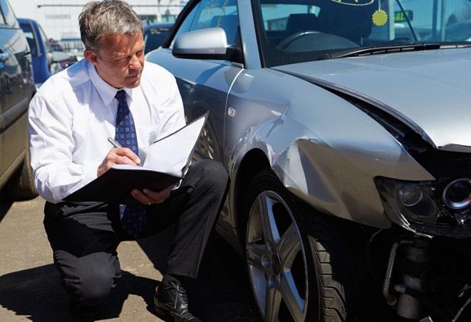 auto insurance agent discussing policy options with client